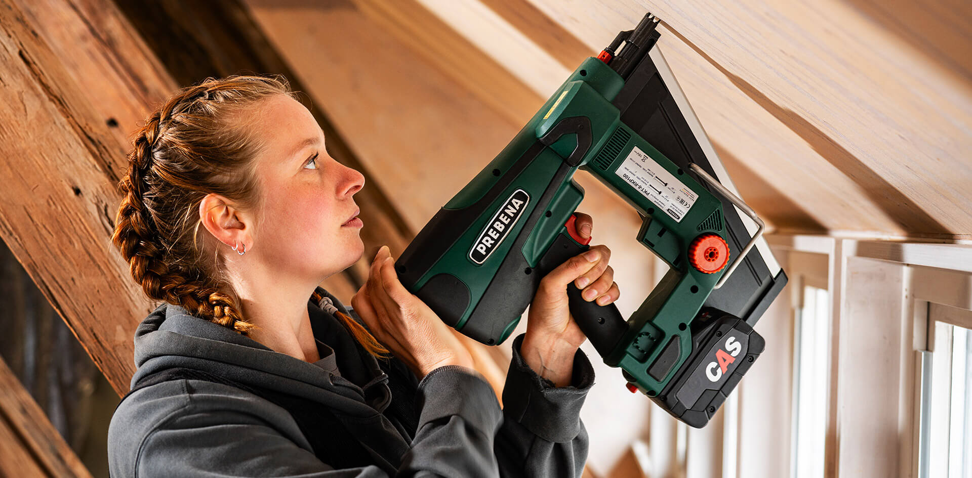 Craftswoman works wood cordless with a tool with CAS battery